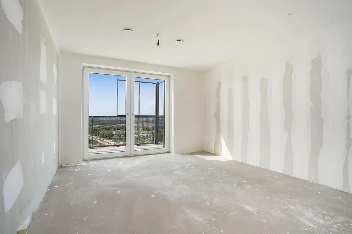 Photo of an empty room with no kitchen, the kind you take with your iPhone